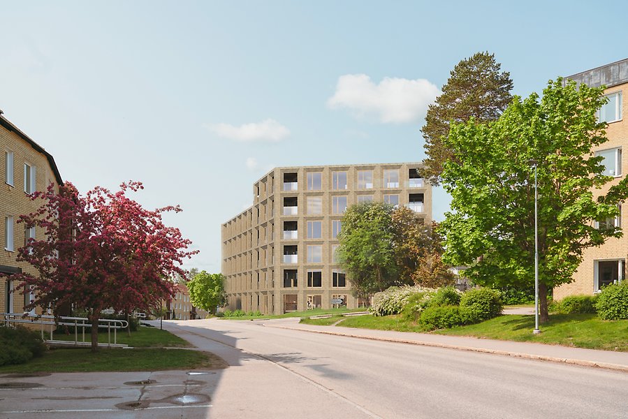 Illustration av byggnad i gult tegel längs en bilväg.
